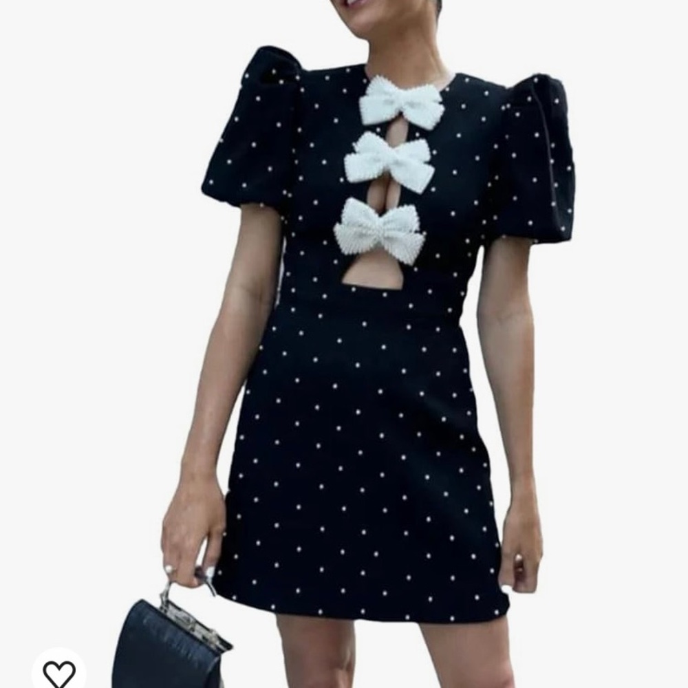 Navy dress with beaded bows. Gorgeous, like Rebecca Vallance.